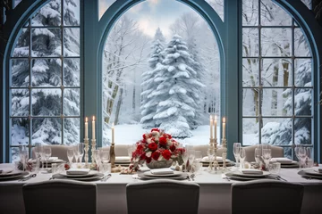 Zelfklevend Fotobehang Christmas dinner table setting with candles and roses, windows looking on snow covered trees, winter holiday season, tablescape © Sunshower Shots