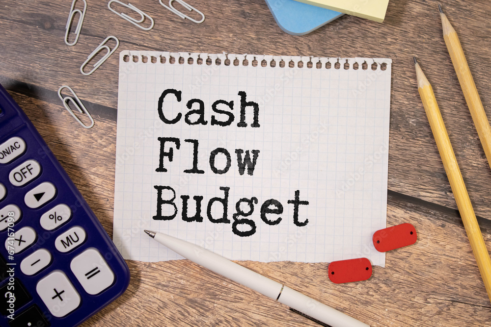 Poster text cash flow control on sticky notes with copy space and paper clip isolated on red background.