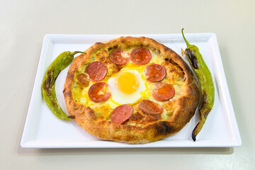 Kiymali pide.Turkish pide with minced meat. Turkish pizza mince pita Pide on white background. Etli ekmek. Kusbasi kasarli, kiymali kasarli, kiymali yumurtali,  tirnak Trabzon, Bafra, Kusbasili pide.