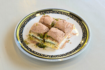 Turkish Dessert Sobiyet  Baklava, mussels baklava and classic baklava with Pistachio . Cevizli, Fistikli Baklava, top view.