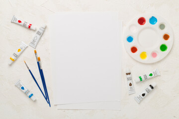 Painting tools on concrete background, top, view