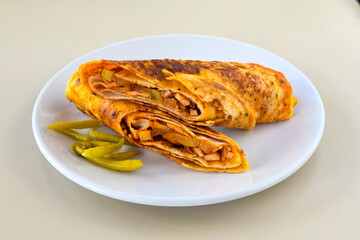 Lavash doner kebab ( zurna doner durum )  or shawarma sliced in plate isolated.  Tavuk Et Doner Durum. Hatay usulu tavuk doner durum. 