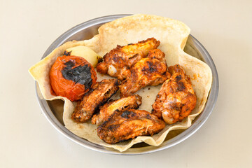 Chicken wings barbeque in a dish with BBQ grill sauce . Izgara tavuk kelebek sis kanat. Tavuk sis, gogus.