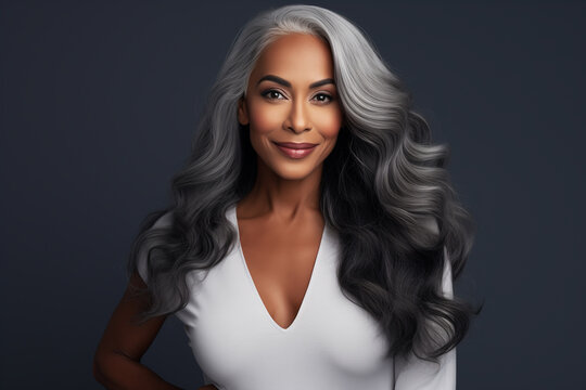 attractive middle aged african american woman with long white hair. beauty, hair care concept. attraction and force. dark background