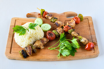 Beef steak grill with rice pilaf, fried potatoes, grilled pepper and tomatoes.Mix Platter with Beef rips, Cutlets, Potatoes and Sauces.