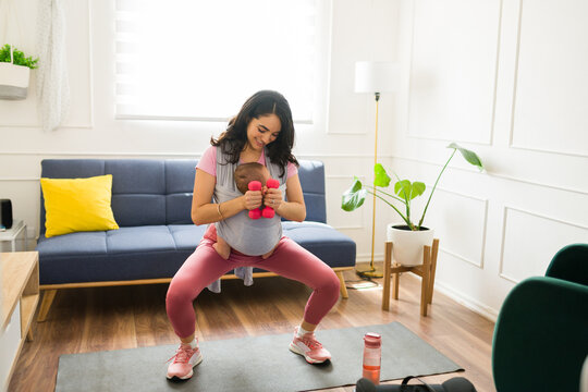 Active Mom Working Out With Her Newborn Baby