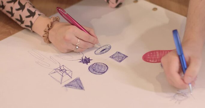 Drawing on paper, expressing yourself in an image. Finding mental balance through expression in creativity. Reflexive hand movements.