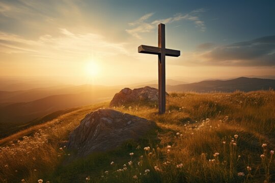 Sunrise outdoors Christian cross on hill signifies Jesus resurrection
