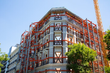 Madrid, Spain. May 9, 2022. Restoration construction of an old apartment building, house facade....