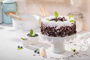 Sweet blueberry cake made of cream, sugar and fruits.