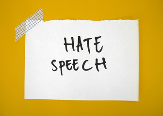 The word hate speech stands on paper speech, Asian hate, political correctness, racism, defamation