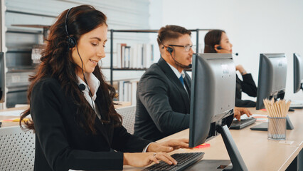 Business people wearing headset working in office to support remote customer or colleague. Call center, telemarketing, customer support agent provide service on telephone video conference call. Jivy - obrazy, fototapety, plakaty