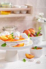 Sweet peach meringue made of fresh fruits.