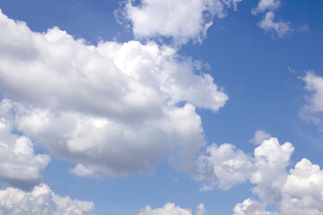 Beautiful blue sky background with natural white clouds.