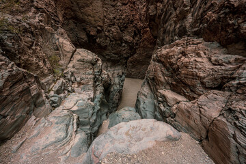 Colorful Rocks Guard The Entrance AT The End of Upper Burro Mesa Wash Pouroff