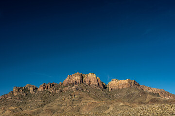 Crown Mountain Stands Tall Below The Dark Blue Sky Above