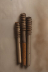 The unicolor background highlights the metallic textures of some rusted parts