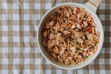 Homemade chicken breast pasta in a pan for high protein and diet recipe.