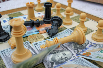 bitcoin and other bills on the chess board