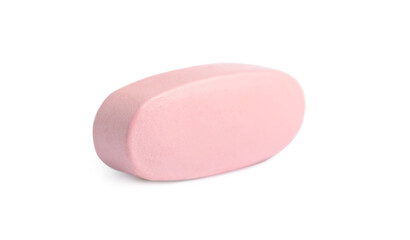 One pink pill on white background. Medicinal treatment