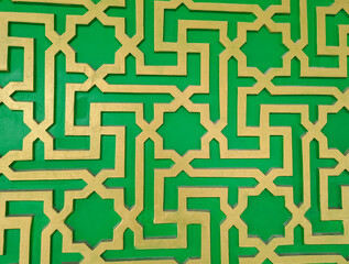 Green and yellow Islamic background with traditional style arabic. Seamless pattern for card, background, fabric or abstract design. Muslim ornament.