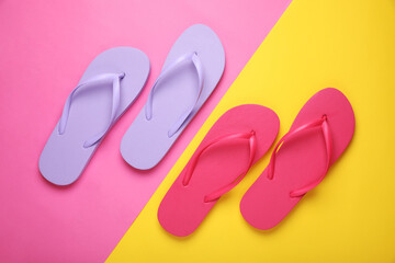 Different stylish flip flops on color background, flat lay