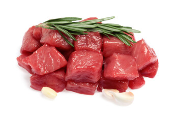 Pieces of raw beef, rosemary and garlic isolated on white