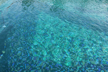 Fototapeta na wymiar Clear rippled water in swimming pool outdoors