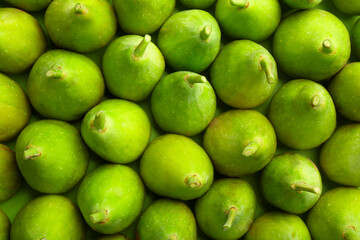 Many fresh green figs on table, top view