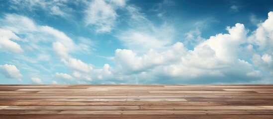 The background image consists of a sky that is a shade of blue and a floor made of wood with a cloudy appearance