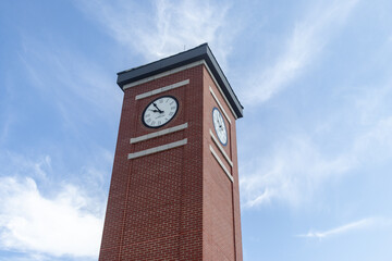 Red brick clock tower - blue sky background