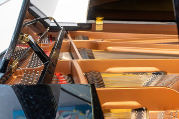 Close-up of piano strings and hammers - grand piano interior detail