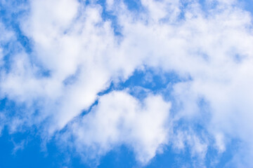 beautiful blue sky and white fluffy group of clouds with sunrise in the morning, natural background