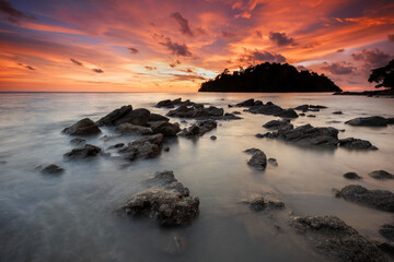 Tranquil sunset over rocky coastal landscape, reflecting beauty in nature at Pulau Sayak Kuala Muda...