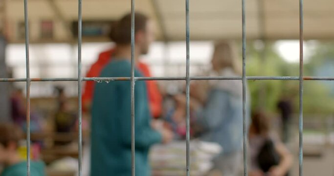 Youth rights in prison. Troubled teen industry to refer to broad range of youth residential programs aimed at struggling teenagers. Rehabilitation behavior modification. Background bokeh behind bars 