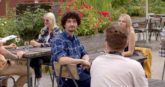 Announcing Event Rules: The organizer of the speed dating event begins by making announcements and explaining the rules and guidelines to the attendees. Specific instructions or expectations.