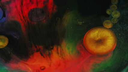 Color mist. Ink water bubble. Blur red yellow green black glitter smoke texture oil paint round drop floating on dark abstract art background.