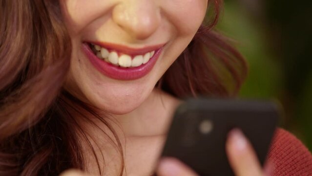 Close up mouth of Happiness beautiful young woman use mobile phone for shopping online smile and enjoy with social media and laptop at home. Small Business Startup.online banking