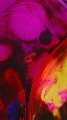 Paint drop. Ink water splash. Emulsion bubble. Bright neon pink yellow color oil texture fluid mix motion on dark art abstract background.