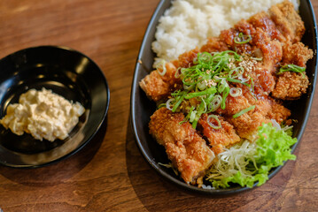 Chicken Katsu Curry is a dish of crispy chicken pieces served over rice with Japanese curry sauce.