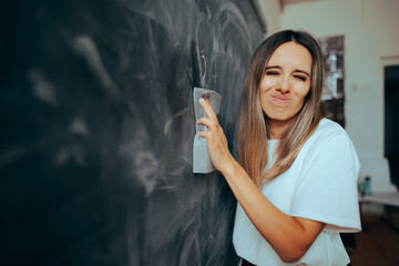 Funny Teacher Wiping the Blackboard Inhaling Chalk Dust. Professor suffering from an occupational disease due to chalk particles inhalation
 - obrazy, fototapety, plakaty