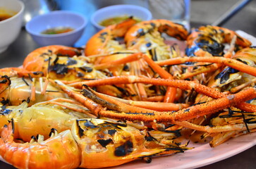 Grilled Giant River Prawn set in the plate for eating. It is a food menu that tourists love when they go to eat Thai-style seafood.