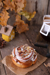 Pastries and coffee in a drip bag on a wooden table.