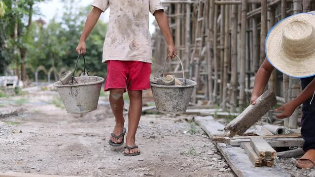 The concept of child labor, Poor children are forced to work in construction, Violence children and trafficking concept, Rights Day, World Day Against Child Labour concept