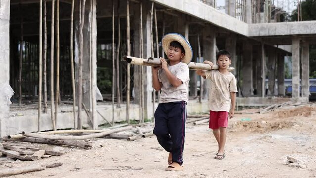 Children working at construction site.  Poor children are forced to work in construction, Violence children and trafficking concept, Rights Day, World Day Against Child Labour concept