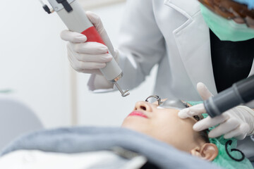 Woman receiving pico laser facial treatment in beauty Clinic.