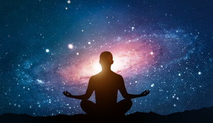 Obraz na płótnie Canvas Silhouette of human sitting on stars background. Woman yoga pose. Meditation in yoga. Psychology and relax. Nightly starry space landscape. Success and motivation. Lifestyle and freedom concept.