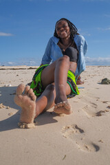 girl on the beach close up feet