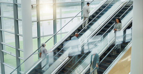 Business people, elevator and travel with office and international trip with lens flare. Corporate, professional on escalator and appointment with conference, stairs for convention and executives - Powered by Adobe