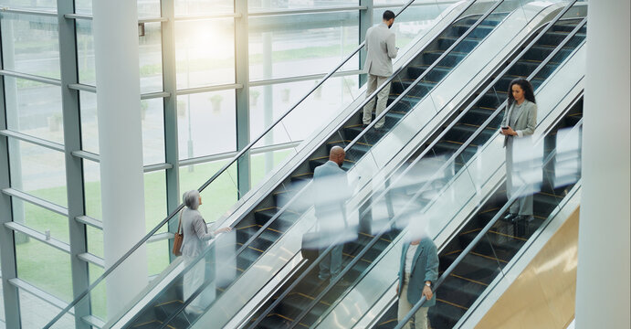 Business People, Elevator And Travel With Office And International Trip With Lens Flare. Corporate, Professional On Escalator And Appointment With Conference, Stairs For Convention And Executives